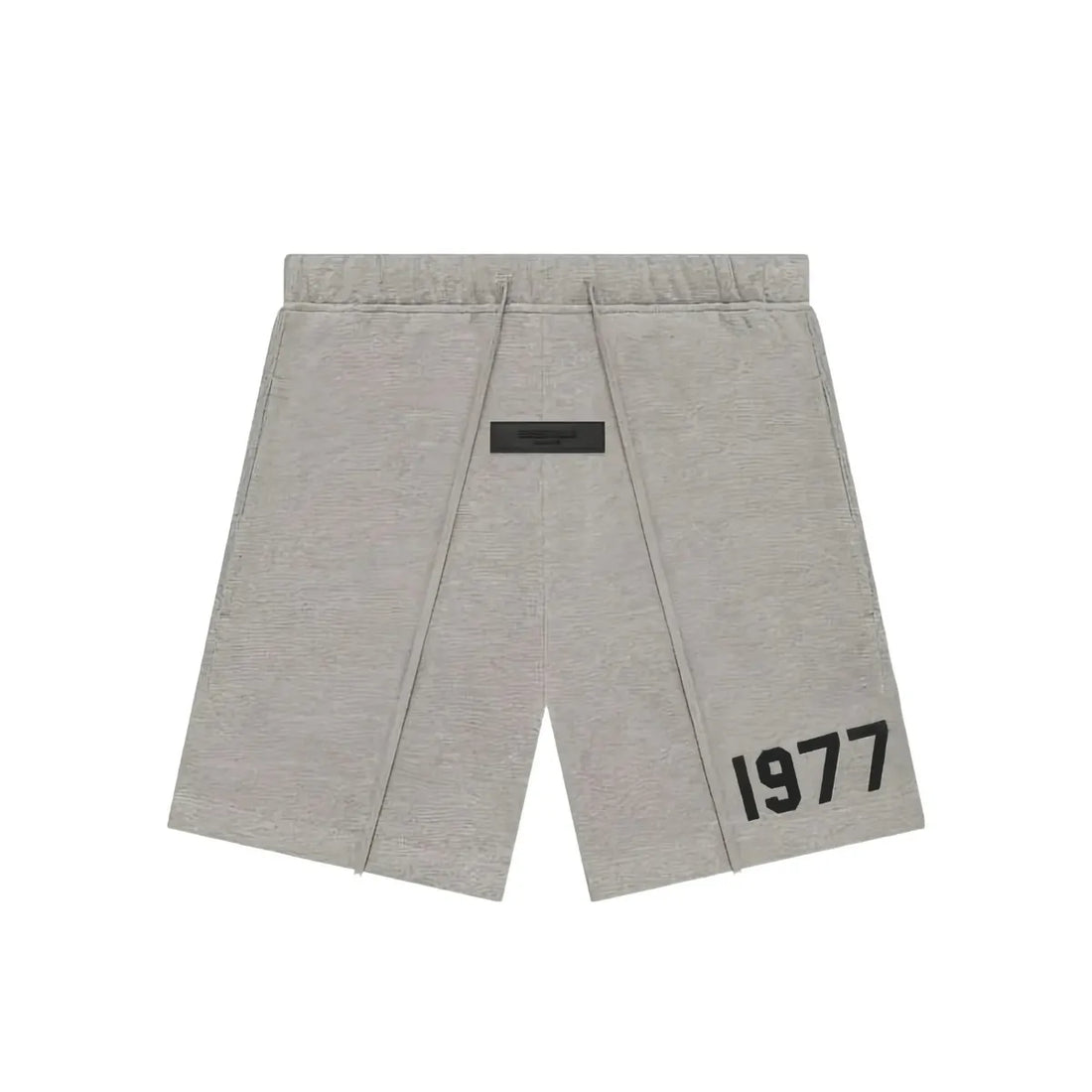 Fear of God Essentials 1977 Dark Oatmeal sweatshort with black drawstring and "1977" graphic.