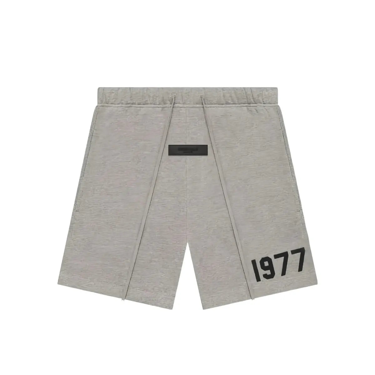 Fear of God Essentials 1977 Dark Oatmeal sweatshort with black drawstring and "1977" graphic.