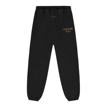 Czarne spodnie dresowe Fear of God Essentials z polaru ze złotym logo i sznurkami.